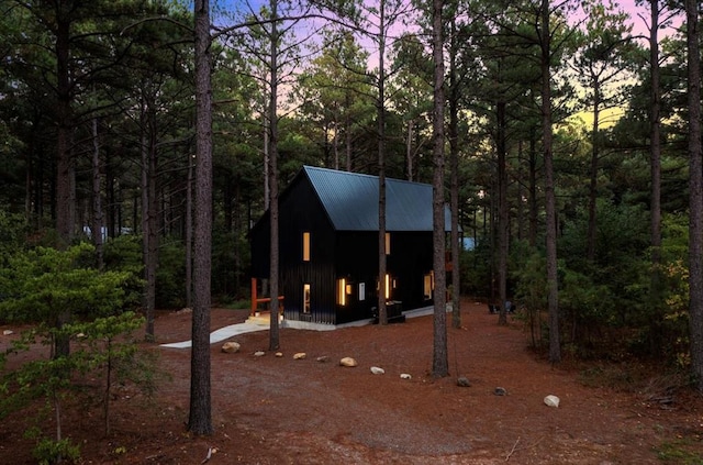 view of property exterior at dusk