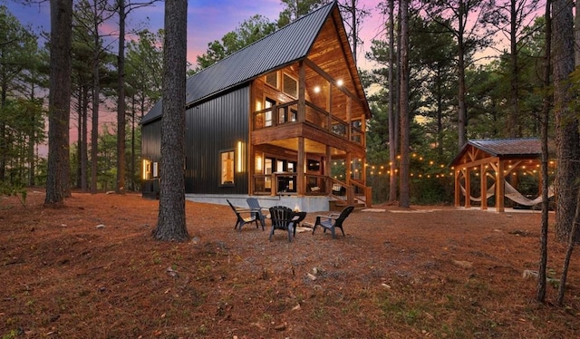 view of back house at dusk