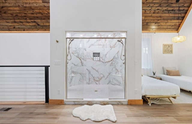 foyer entrance featuring lofted ceiling, hardwood / wood-style floors, and wood ceiling