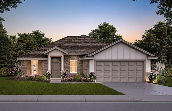 view of front of home featuring a lawn and a garage