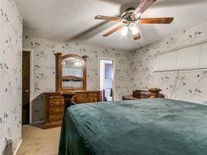 bedroom with ceiling fan and light colored carpet