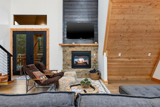 living room with hardwood / wood-style flooring and a fireplace