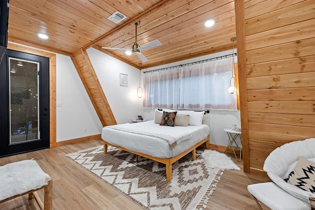 bedroom with hardwood / wood-style floors and wood ceiling