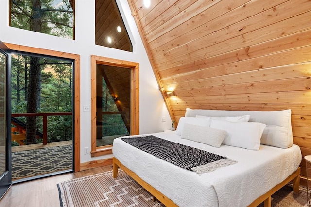 bedroom featuring high vaulted ceiling, wood ceiling, and hardwood / wood-style flooring