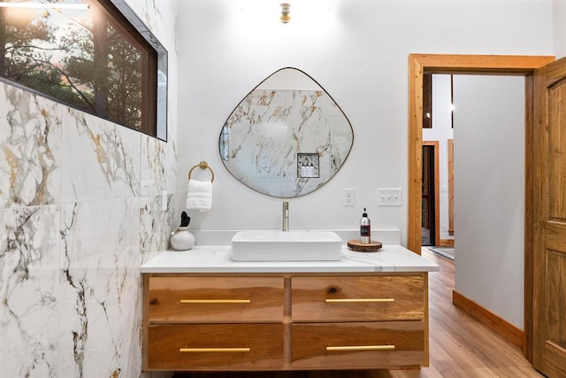 bathroom with vanity and hardwood / wood-style flooring