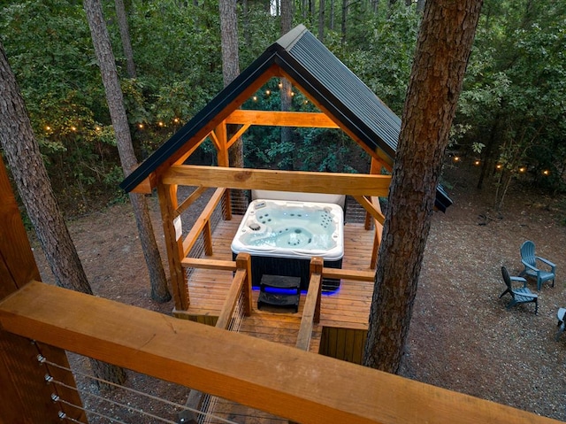 exterior space with a hot tub