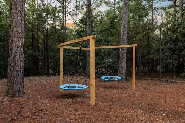 playground at dusk with a trampoline