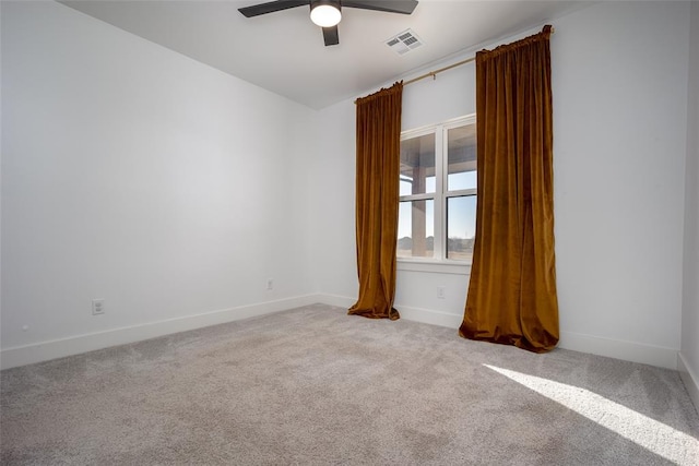 carpeted empty room featuring ceiling fan