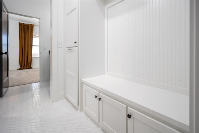 mudroom with light carpet