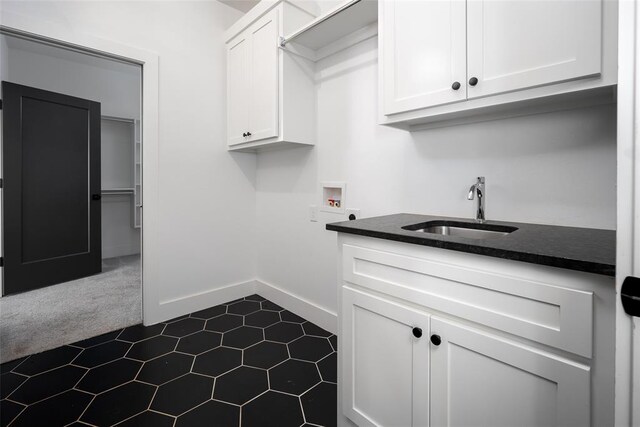 laundry room with cabinets, sink, and hookup for a washing machine