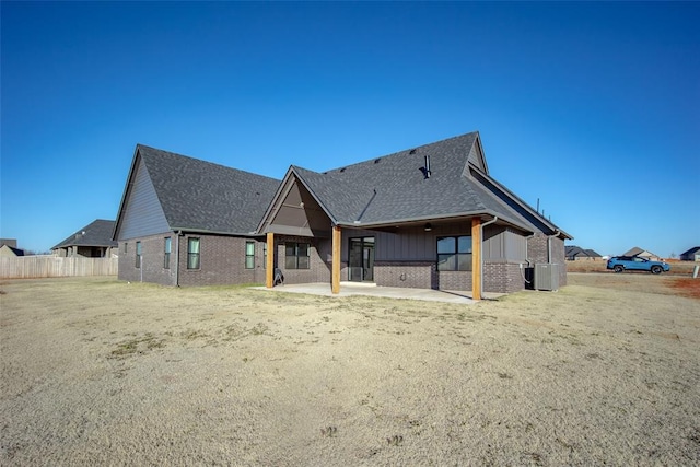 rear view of house featuring a patio area and central air condition unit