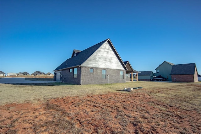 view of side of property featuring a yard