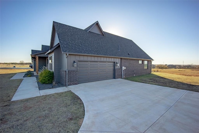 view of home's exterior featuring a yard and a garage