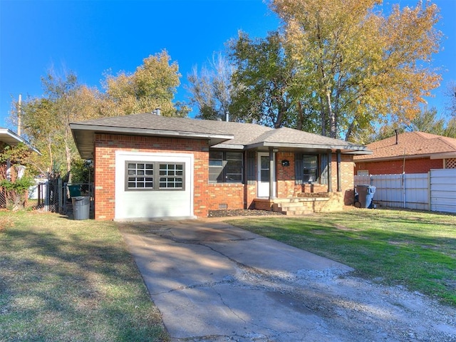 view of front facade with a front yard and a garage