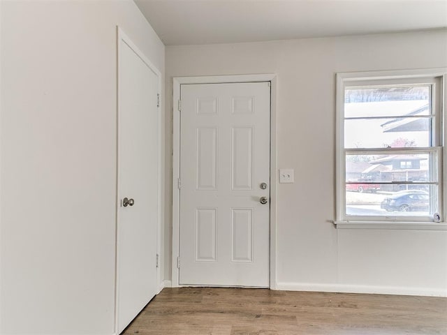 doorway to outside with hardwood / wood-style flooring