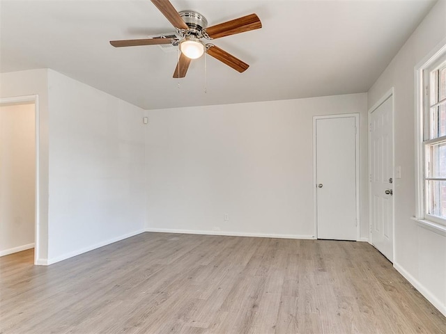 spare room featuring ceiling fan and light wood-type flooring