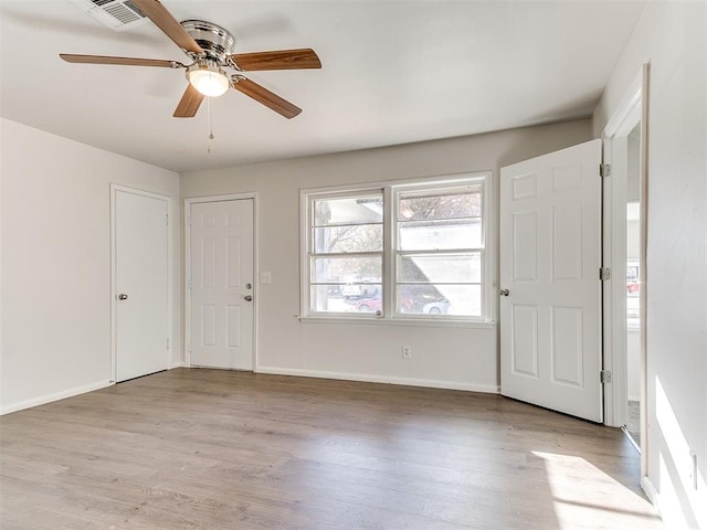 foyer featuring ceiling fan and light hardwood / wood-style flooring