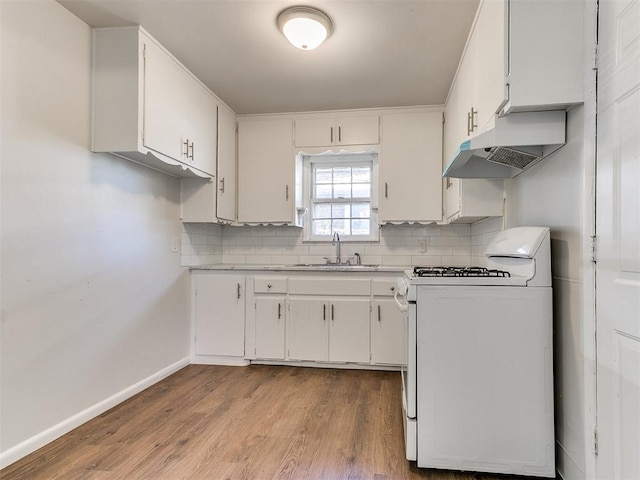 kitchen with white range with gas stovetop, white cabinets, light hardwood / wood-style flooring, and sink