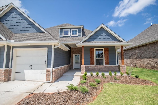 craftsman inspired home with a porch and a garage