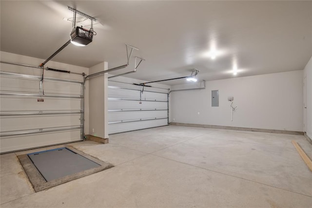 garage with electric panel and a garage door opener