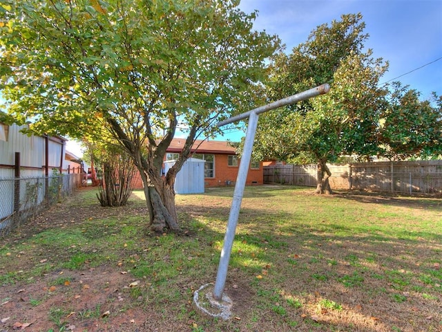 view of yard with a storage unit