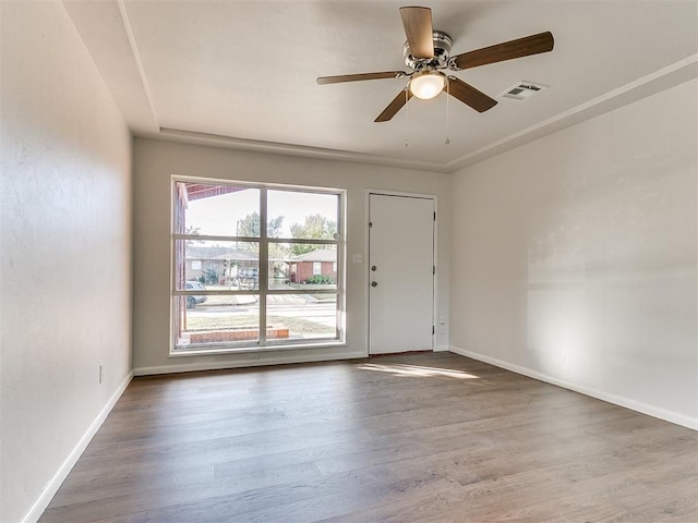 empty room featuring ceiling fan and hardwood / wood-style floors