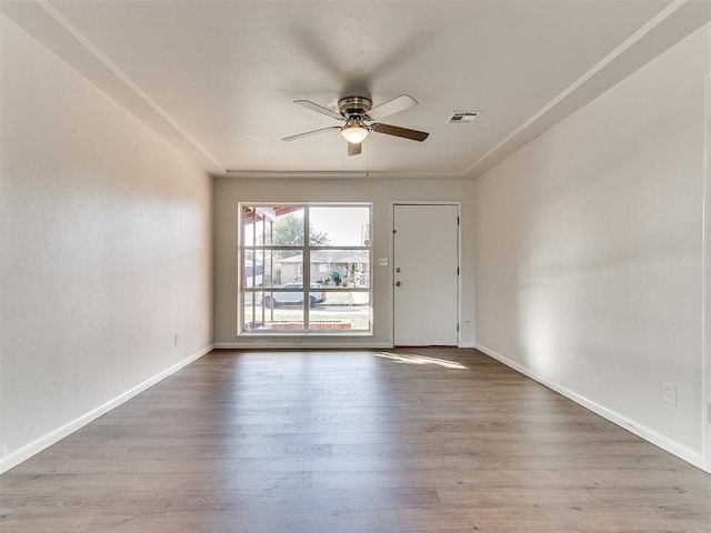 unfurnished room with ceiling fan and light hardwood / wood-style floors