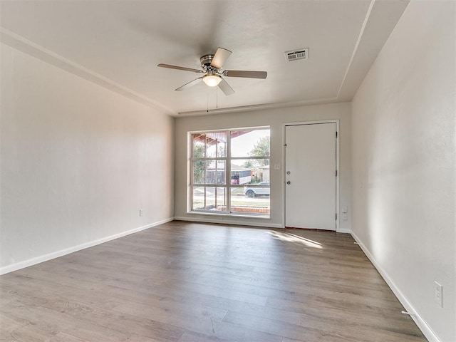 unfurnished room featuring ceiling fan and wood-type flooring