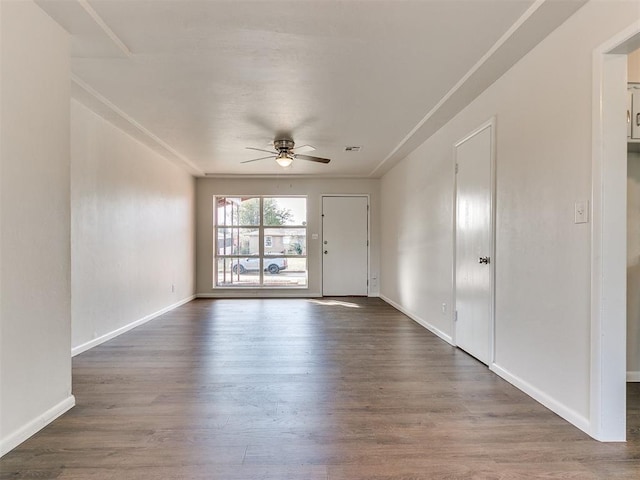 empty room featuring ceiling fan and dark hardwood / wood-style floors