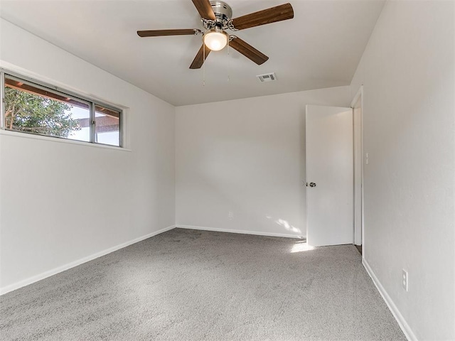 carpeted empty room with ceiling fan