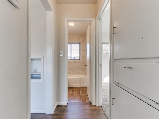 hallway featuring dark wood-type flooring