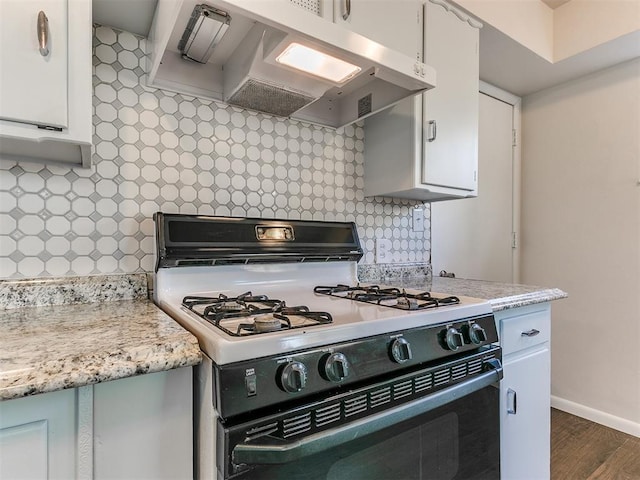 kitchen featuring white cabinetry, white gas range, and exhaust hood