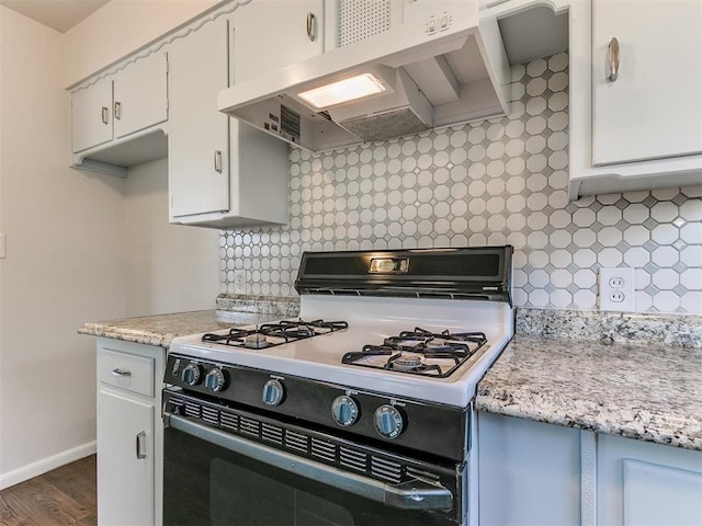 kitchen featuring decorative backsplash, ventilation hood, dark wood-type flooring, white cabinetry, and range with gas stovetop