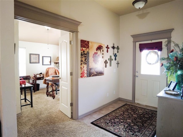 entrance foyer with light colored carpet