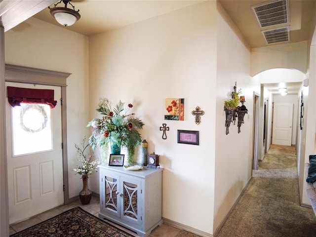 foyer with light carpet