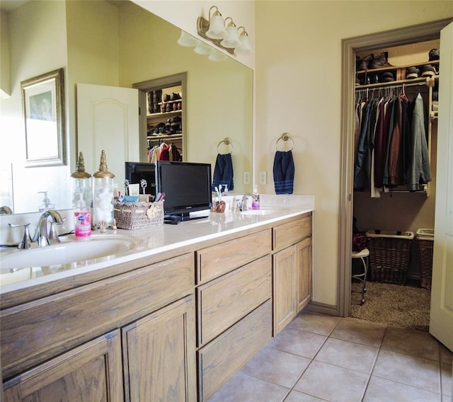 bathroom featuring tile patterned flooring and vanity