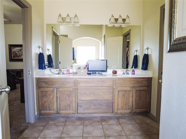 bathroom featuring tile patterned flooring and vanity