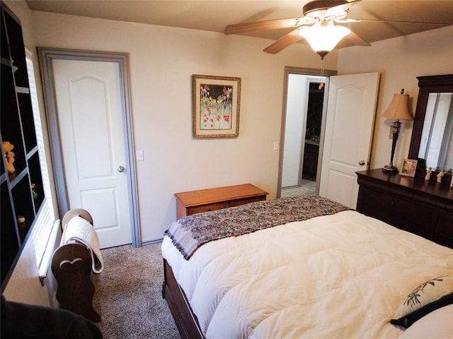 carpeted bedroom featuring ceiling fan