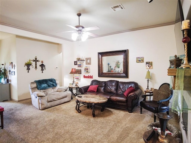 living room featuring carpet flooring, ceiling fan, and ornamental molding