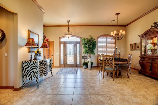 entrance foyer featuring light tile patterned floors, an inviting chandelier, and ornamental molding