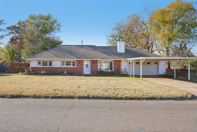 ranch-style house with a carport and a front lawn