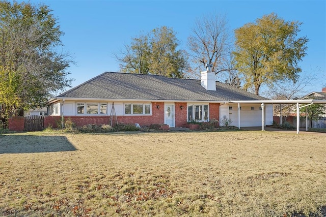 ranch-style home with a front lawn and a carport