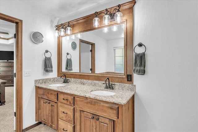 full bathroom featuring a sink and double vanity