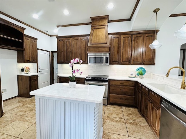 kitchen featuring appliances with stainless steel finishes, backsplash, a sink, and crown molding