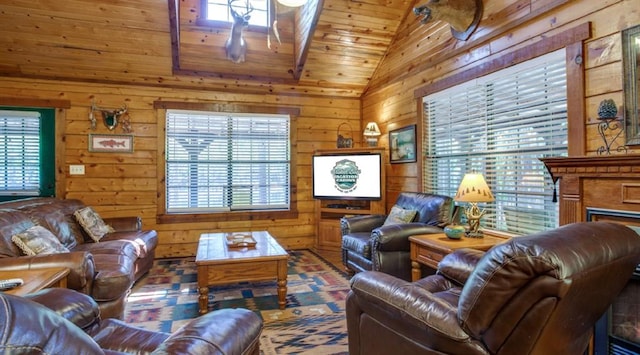 living room featuring wooden walls, a wealth of natural light, lofted ceiling, and wood ceiling