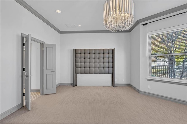 unfurnished bedroom featuring carpet floors, crown molding, and a notable chandelier