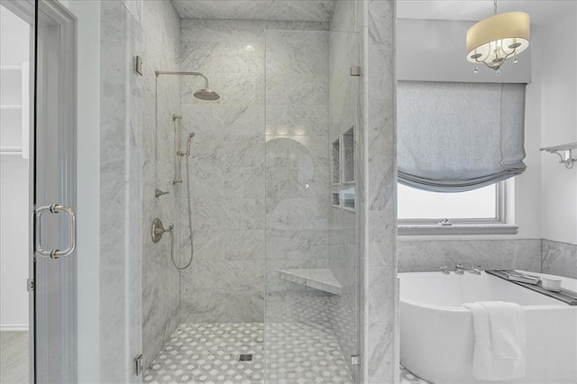 bathroom with shower with separate bathtub