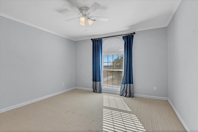 unfurnished room with ceiling fan, light colored carpet, and ornamental molding