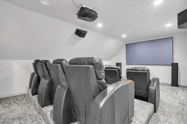 home theater with light carpet and lofted ceiling