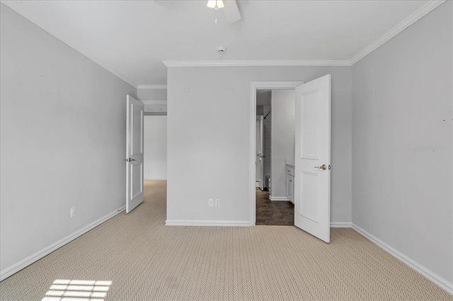 unfurnished bedroom featuring ceiling fan, light carpet, and ornamental molding